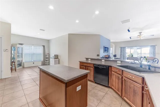 a kitchen with stainless steel appliances granite countertop a sink and cabinets
