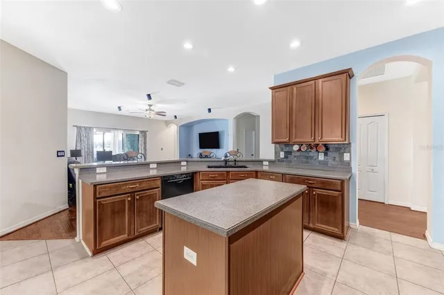 a kitchen with stainless steel appliances granite countertop a stove and a sink