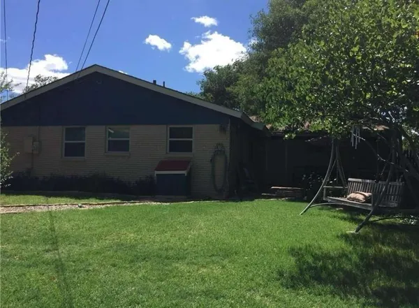 a backyard of a house with lots of green space
