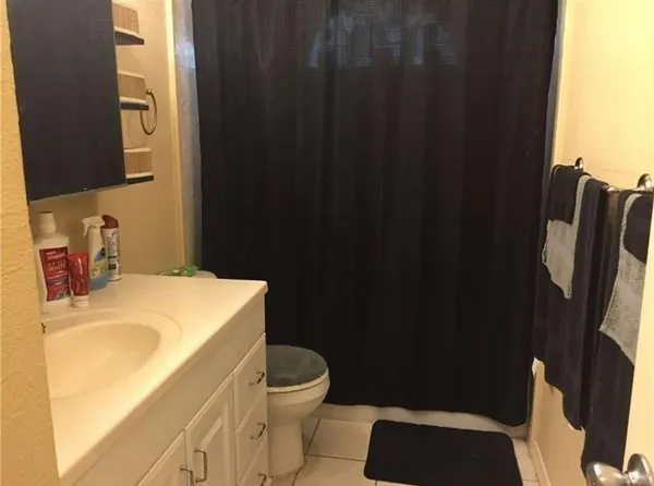a bathroom with a sink toilet and vanity