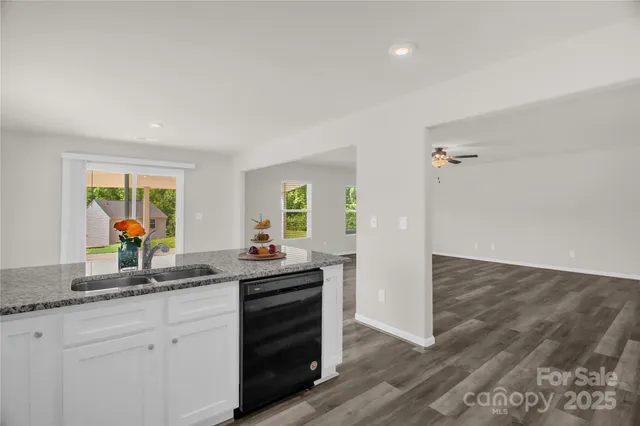 a kitchen with sink and cabinets
