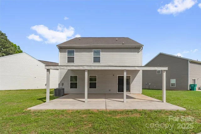 a house that has a big yard in front of it