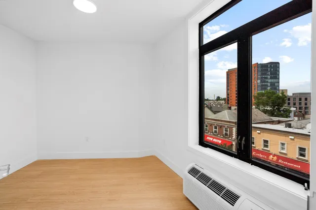 a view of a living room with a large window