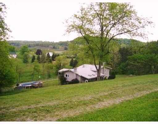 113 Simcik Road Kittanning, PA 16201 - Photo 3 of 3 Exterior Front. Stucco raised ranch, spacious property and grounds, nice distance between ajoining properties and farms. If privacy is what you are looking for here it is.