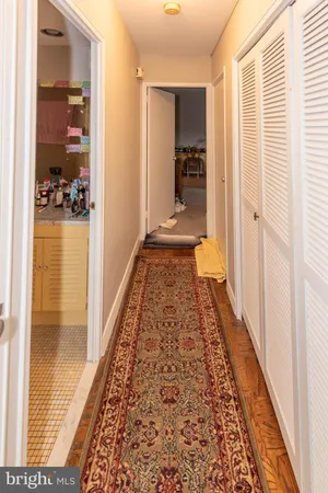 a bathroom with glass door shower and a rug