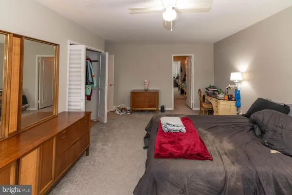 a bedroom with furniture and a window