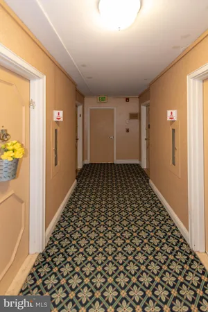 a bathroom with a black white checkered floor