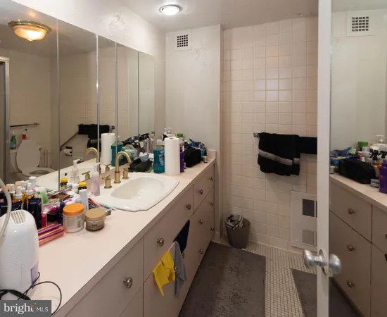 a bathroom with a sink double vanity and a mirror