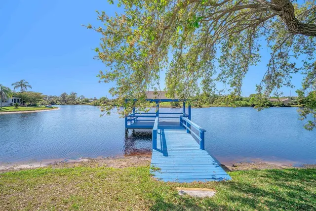 a view of a lake with a bench next to a lake