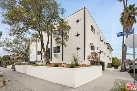a view of a house with yard and tree s