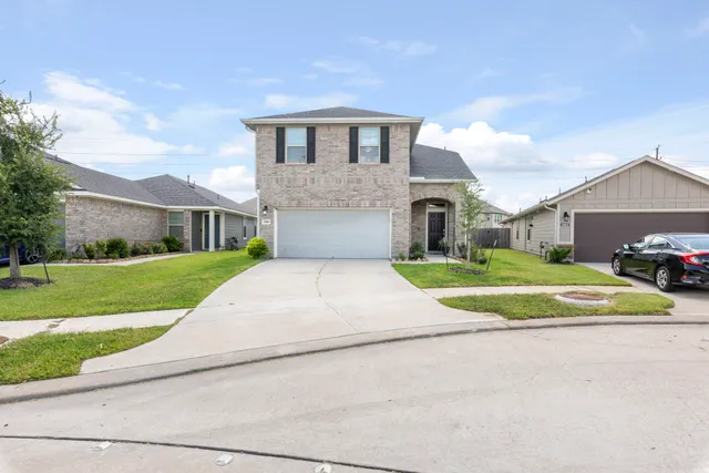 a view of house with yard and street view