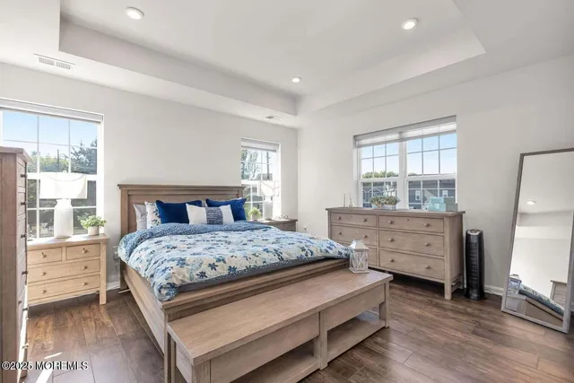 a bedroom with a bed and a dresser