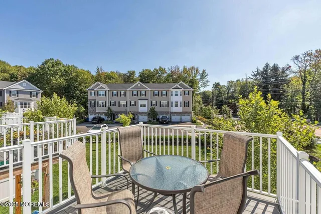 a view of a chair and table in the balcony