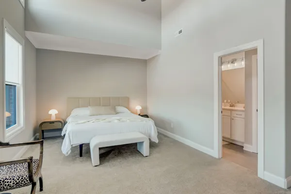 a bedroom with a bed and a table