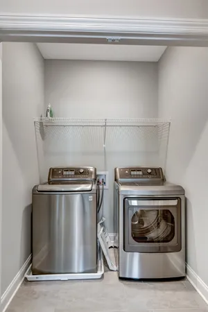 a stove top oven sitting inside of a kitchen
