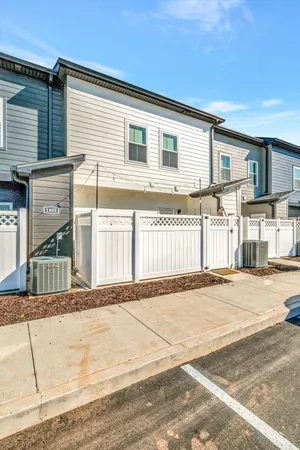 a front view of a house with a road