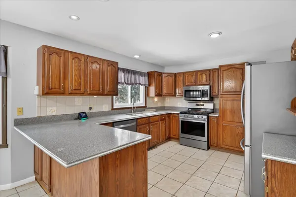 a view of a room with wooden floor and cabinet