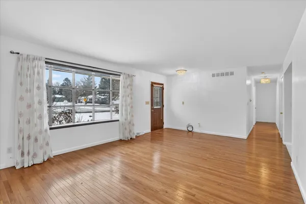 a view of an empty room and window