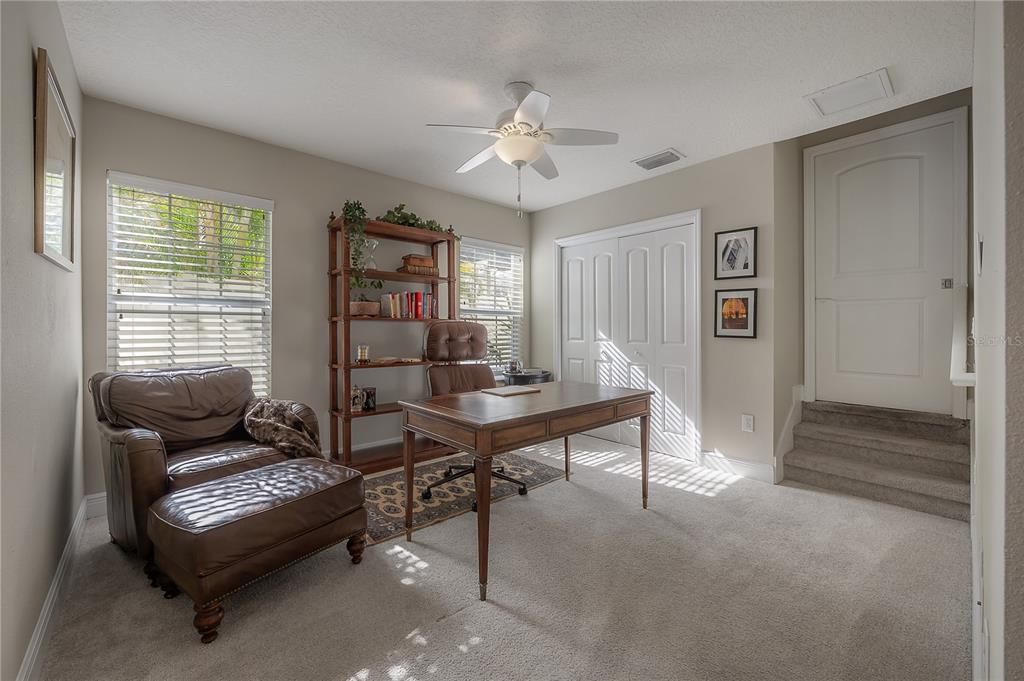 3108 West Villa Rosa Street Tampa, FL 33611 - Photo 32 of 58 a living room with furniture and a large window