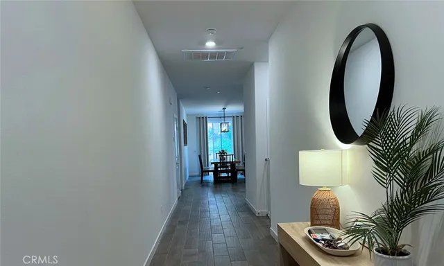 a view of a livingroom with furniture and wooden floor