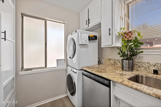 a kitchen with a refrigerator and a sink