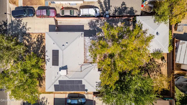 a aerial view of a house with garden space and sitting area