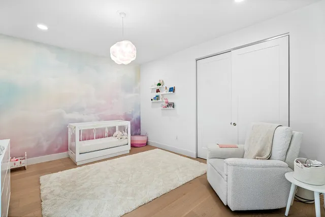 a bedroom with a bed and a couch