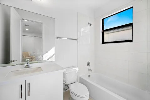 a bathroom with a toilet sink and a bathtub