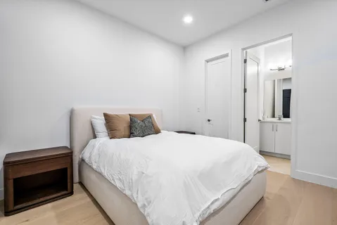 a bedroom with a bed and a view