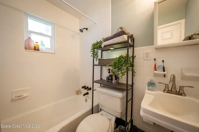 a bathroom with a sink toilet and bathtub