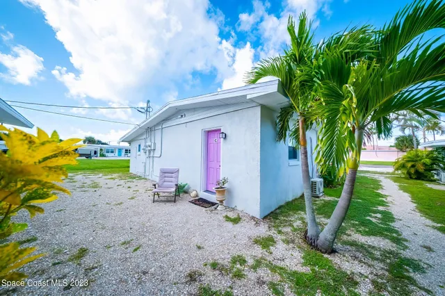 a front view of house with yard and entertaining space