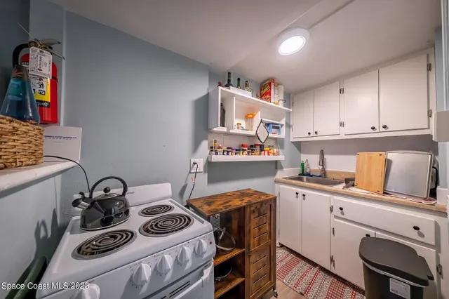 a utility room with sink dryer and washer