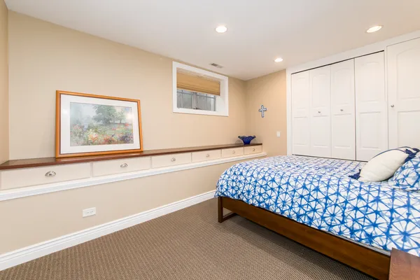 a view of a patio with a table and chairs under an umbrella