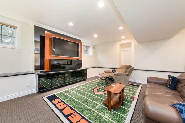 a view of a patio with table and chairs under an umbrella