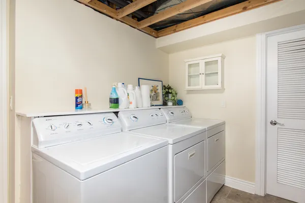 a view of a house with swimming pool and sitting area