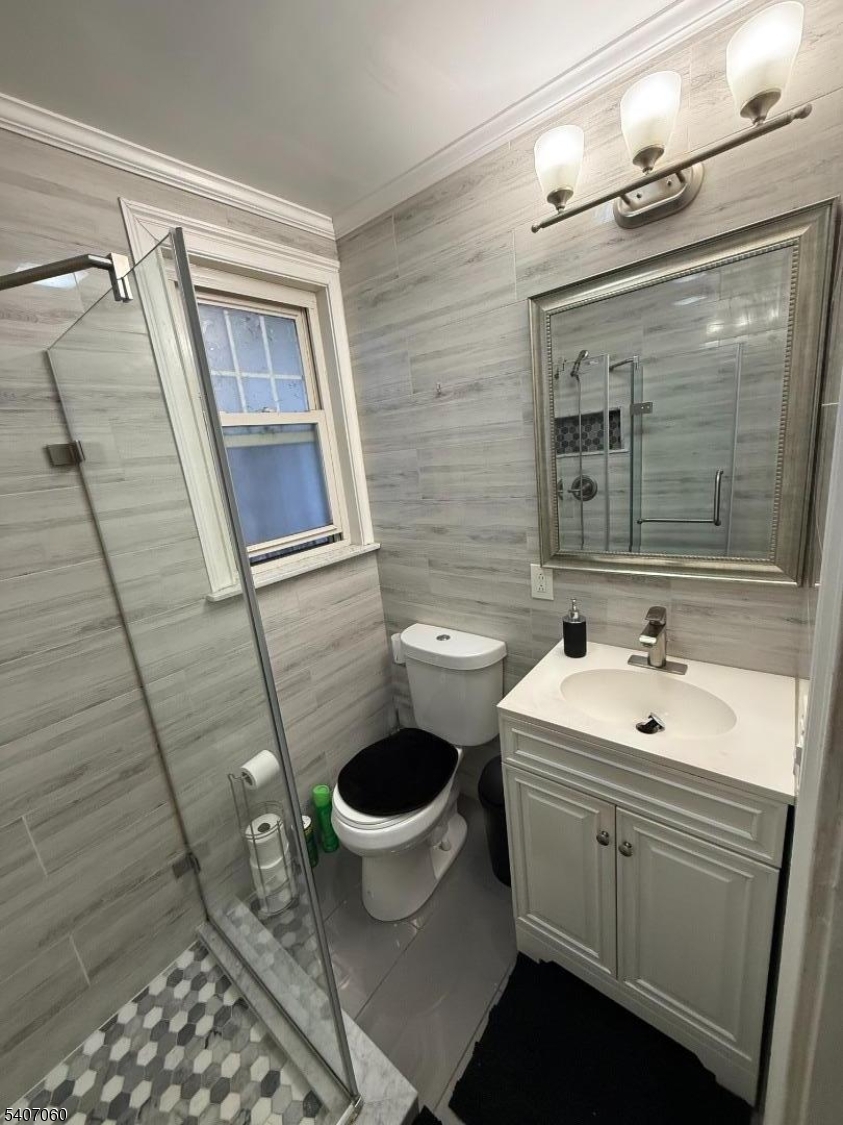 243 Lake Street Newark, NJ 07104 - Photo 2 of 16 a bathroom with a sink toilet and shower