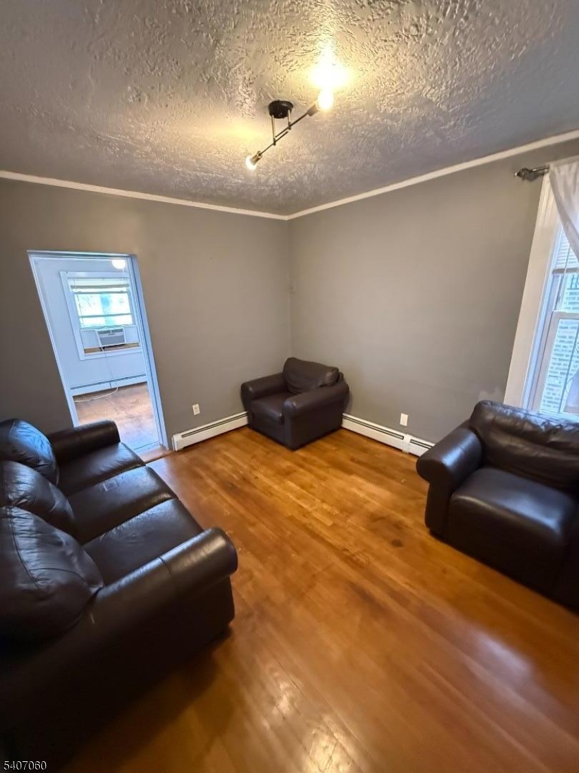 243 Lake Street Newark, NJ 07104 - Photo 8 of 16 a bedroom with a bed and a couch