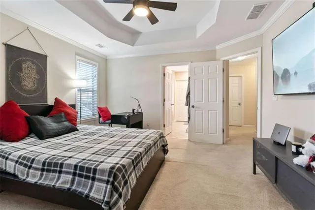 a spacious bathroom with a double vanity sink mirror and bathtub