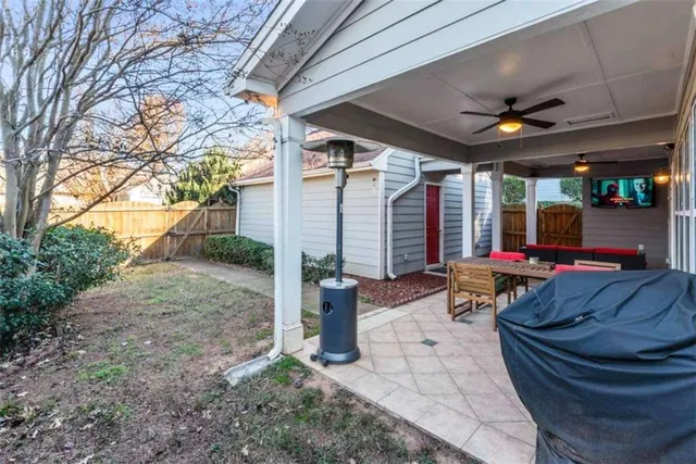 a front view of a house with garden and plants