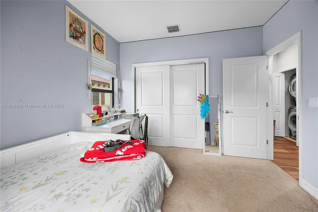 a bedroom with a bed and a closet