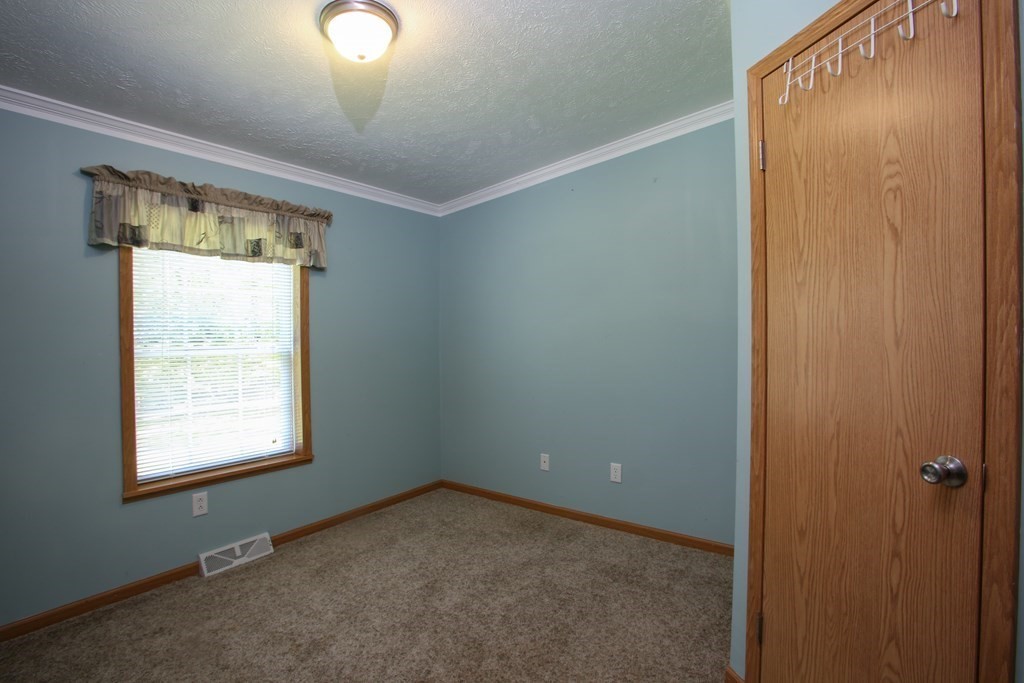 169 Ford Hill Road Rowe, MA 01367 - Photo 12 of 24 an empty room with a window