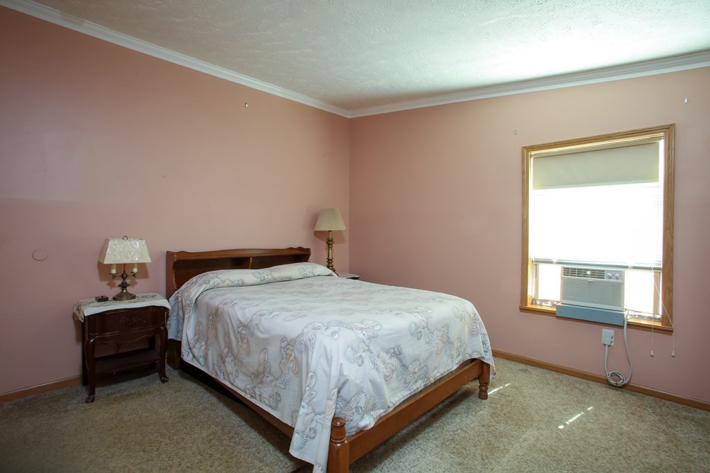 169 Ford Hill Road Rowe, MA 01367 - Photo 14 of 24 a bedroom with a bed and window