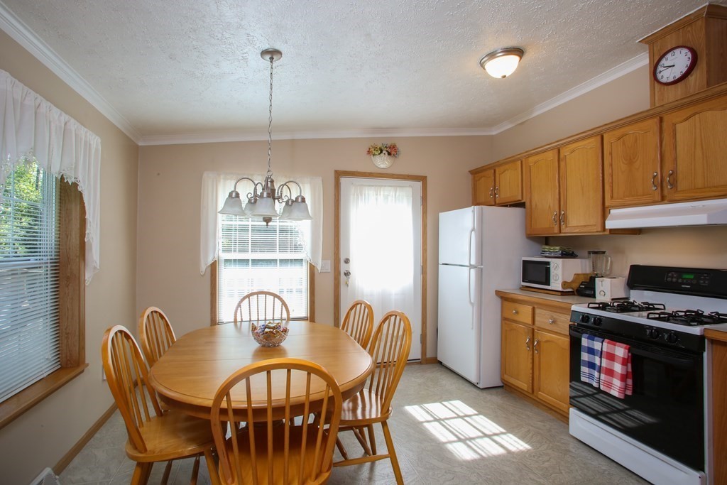 169 Ford Hill Road Rowe, MA 01367 - Photo 7 of 24 a view of a dining room with furniture window and outside view
