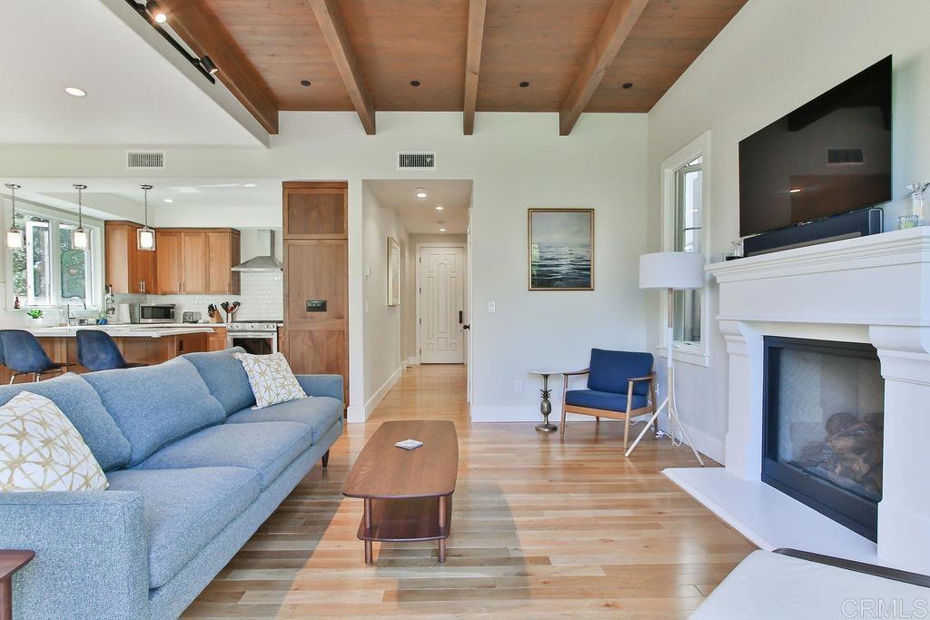 573 H Coronado, CA 92118 - Photo 12 of 39 a living room with furniture and a flat screen tv
