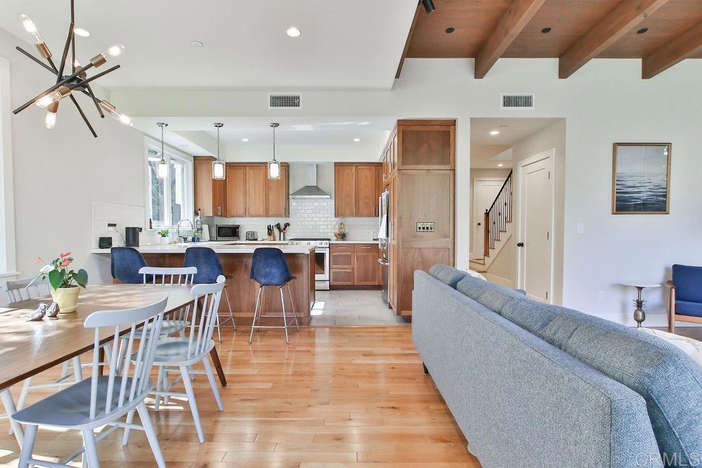 573 H Coronado, CA 92118 - Photo 13 of 39 a living room with stainless steel appliances furniture and a kitchen view