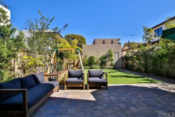 a outdoor living space with furniture and city view