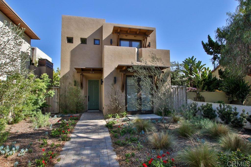 573 H Coronado, CA 92118 - Photo 2 of 39 a front view of a house with a yard