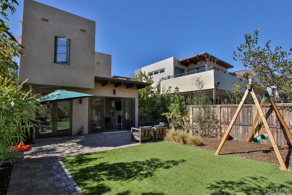 573 H Coronado, CA 92118 - Photo 25 of 39 a view of a house with backyard and a slide