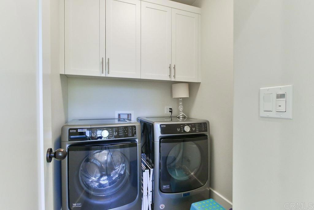 573 H Coronado, CA 92118 - Photo 27 of 39 a utility room with dryer and washer