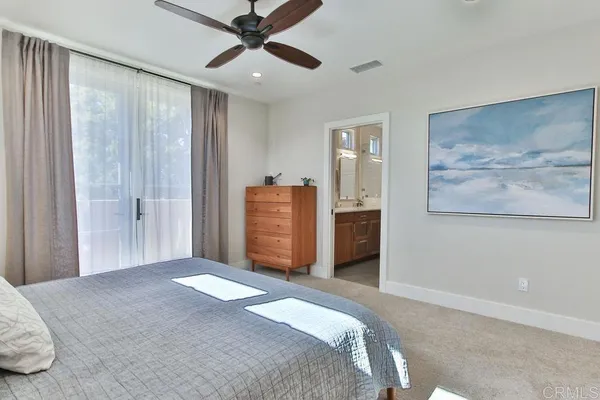 a bedroom with a large bed and closet